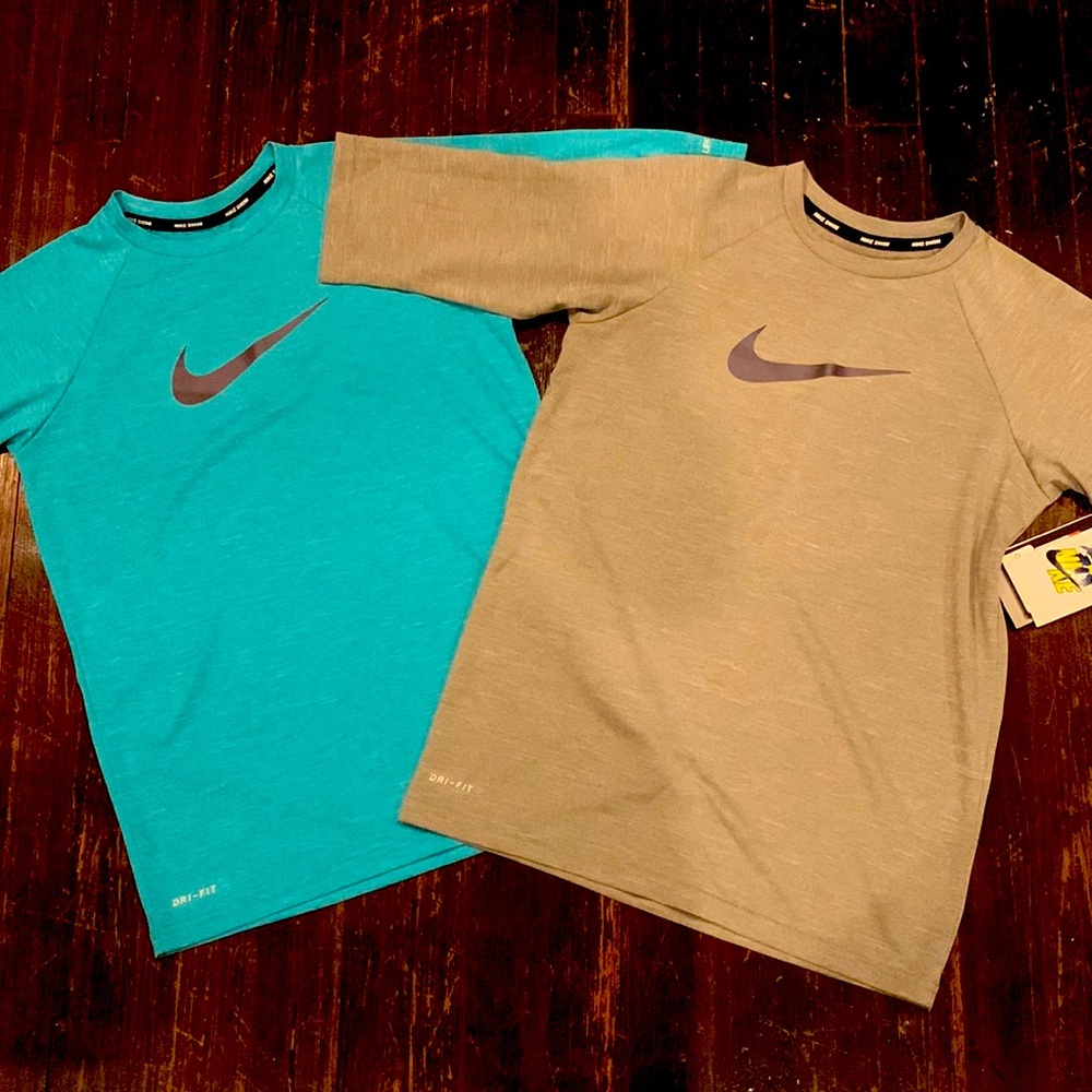 2 Boys Nike swim shirts size large (12-13yrs)